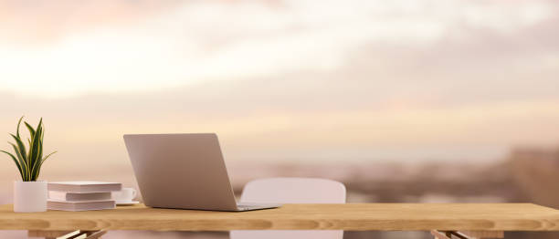 istock Laptop computer and mockup space on wooden table. 1355575934