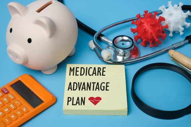 Medicare Advantage Plan A picture of medicare advantage plan on notepad, stethoscope, coronavirus 3D printing, piggy bank and other prop insight. medicare stock pictures, royalty-free photos & images