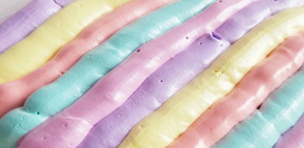 Multicolored meringue is deposited on the surface. Confectionery. Holiday