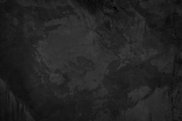 istock Close up retro vignette plain dark black cement (concrete) wall background texture rough old for show surface advertise or promote product and content on display and wallpaper. 1355580983