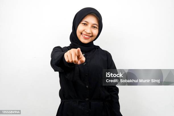 Beautiful Young Asian Muslim Woman With Hands Pointing At Camera Wanting You Pointing At You Wanting To Be With You Smiling Confident Enthusiastic And Cheerful Facing The Camera Isolated On White Background Advertising Concept Stock Photo - Download Image Now