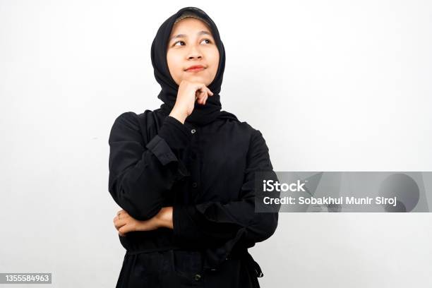 Beautiful Asian Young Muslim Woman Thinking Looking For An Idea There Is A Problem Feeling Strange Something Is Wrong Isolated On White Background Stock Photo - Download Image Now