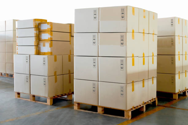 istock Stack of Package Boxes on Pallets in Storage Warehouse. Supply Chain. Storehouse Commerce Shipment. Shipping Warehouse Logistics. 1355589458