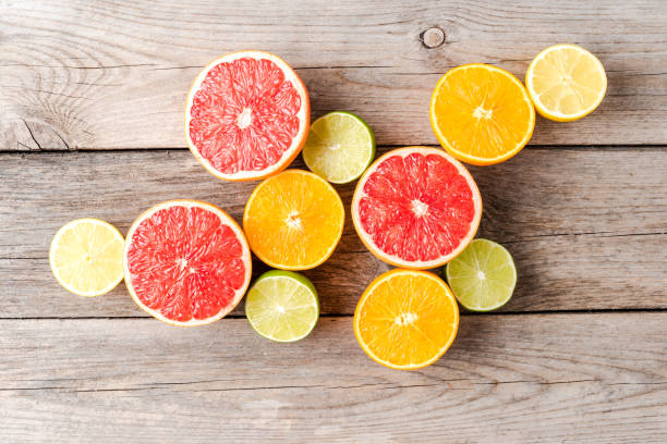 istock Juicy citruses on wooden table. Top view 1355593841