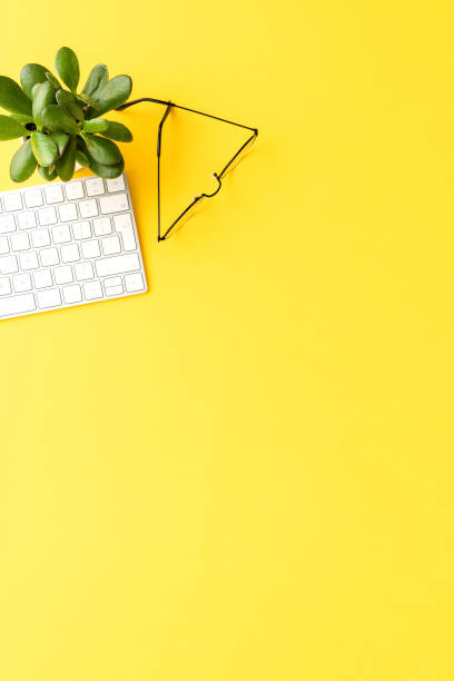 istock Office desktop with computer keyboard and eyeglasses. Business background 1355594001