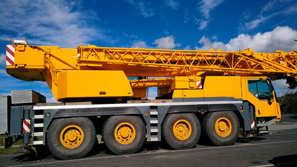 istock Yellow mobile crane for construction in road 1355599651