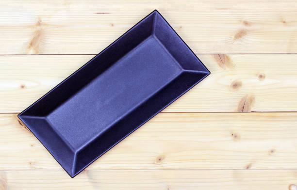 istock ceramic plate on the wooden ground 1355601614