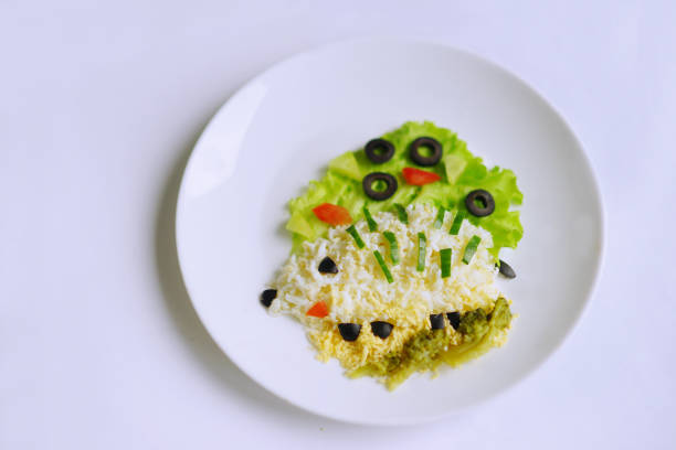 Hedgehog made of eggs and vegetables. Creative dish for Kids. Variation of decorating food.