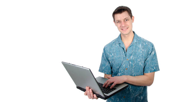 istock Funny handsome man with laptop. Vacation and work. 1355603741