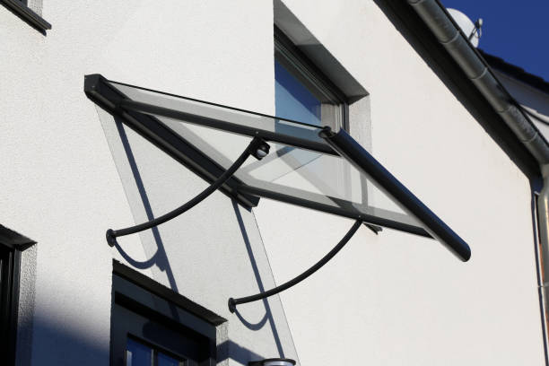 istock New glass canopy on a residential building 1355604688