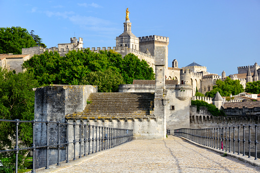Pont d'Avignon (Pont Saint-Benezet) bridge over Rhone River at sunrise, France. On foreground the Chapel of Saint Nicholas which sits on the second pier of the bridge, was constructed in the second half of 12th century