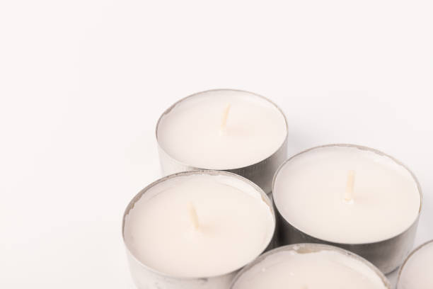 istock Many wax candles together on the white background. Space for text 1355606281