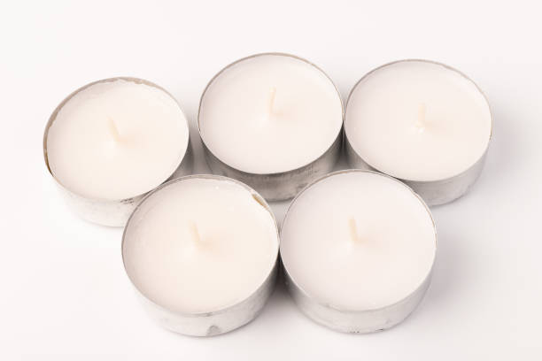 istock Many wax candles together on the white background. Space for text 1355606379