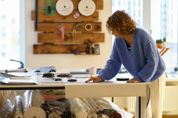 istock Side View Of Woman Working At Table 1355608942