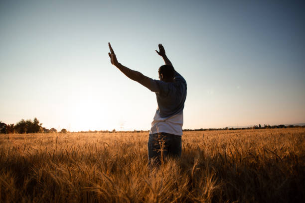istock Full Length Of Man Standing On Field Against Sky 1355609829