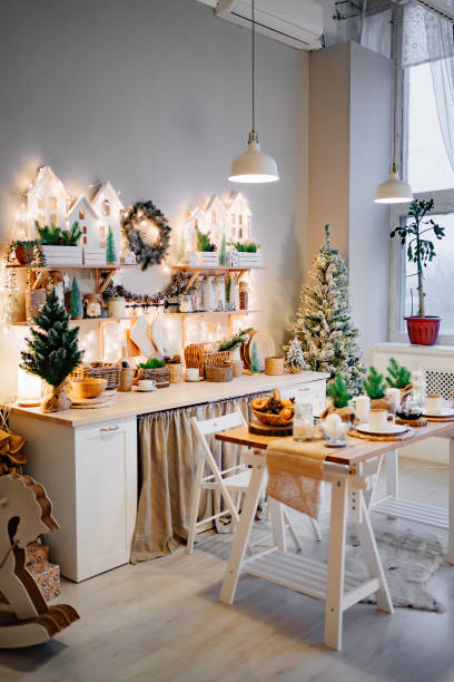 istock side view. Christmas decor. garlands on decorated in kitchen for new year. 1355612317