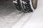 wheel and a tread mark on the snow