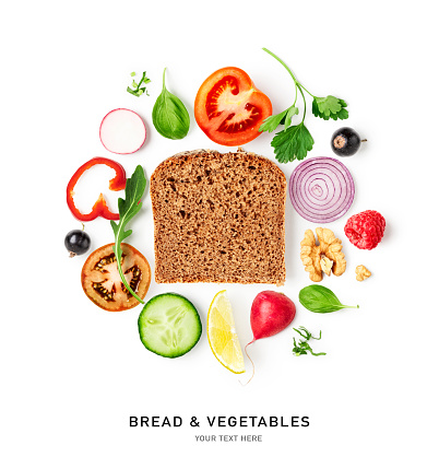 Bread and fresh vegetables creative layout isolated on white background. Food, healthy eating and dieting concept. Tomato, cucumber, pepper, onion, radish, lemon composition. Flat lay, top view