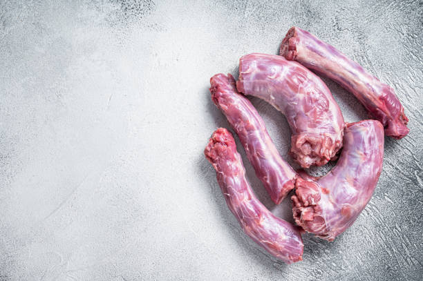 istock Raw Turkey neck meat on a butcher table. White background. Top View. Copy space 1355614684