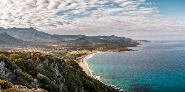 Losari beach and Ile Rousse in Corsica stock photo