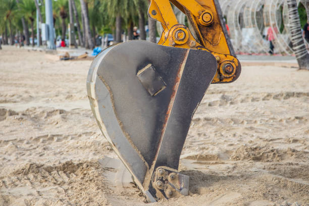 Santander, Spain - May 26, 2018: excavator working on the beach in Santander, Spain