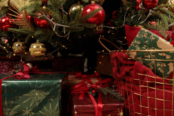 istock Gifts under the Christmas tree close up 1355616170