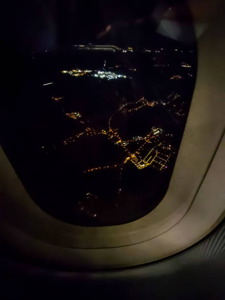 istock Night flight over a large city, view from the plane 1355616443