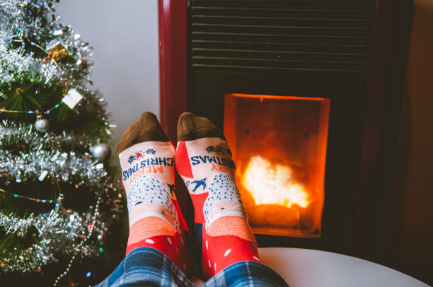 istock Christmas socks by the stove 1355616532