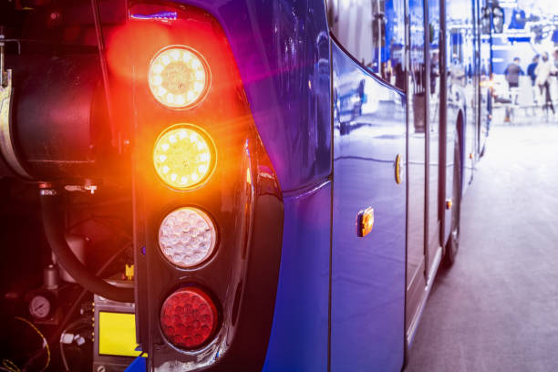 taillights of a city bus at a public transport stop stock photo
