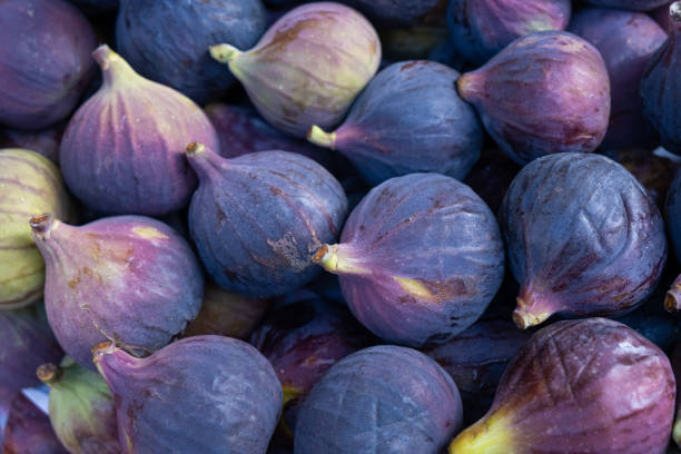 istock fresh jucy figs background berries at market 1355621427