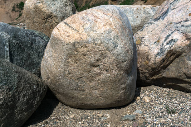 istock A large stone is lying on the sand. 1355623442