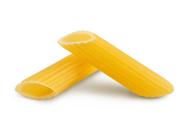 istock Raw italian penne rigate pasta isolated on white background with clipping path and full depth of field 1355624179