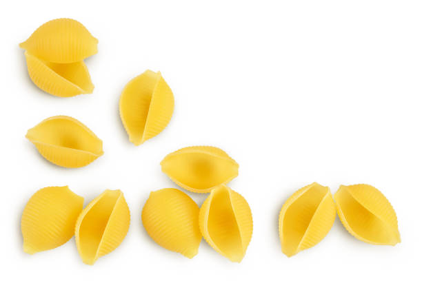 istock Raw conchiglie shell pasta isolated on white bachground with clipping path and full depth of field. Top view with copy space for your text. Flat lay 1355624188