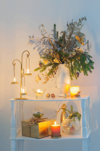 istock christmas decorations with burning candles  on white background at the evening 1355624367