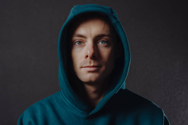istock Handsome man in hood closeup 1355625667