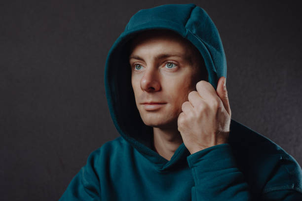 istock Handsome man wearing hood closeup 1355625690
