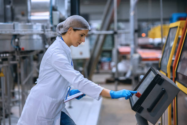istock Female engineer working on maintenance in bottling plant 1355626841