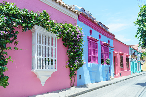 Horizontal view of colorful houses with pink and blue walls. Travel to Colombia concept.