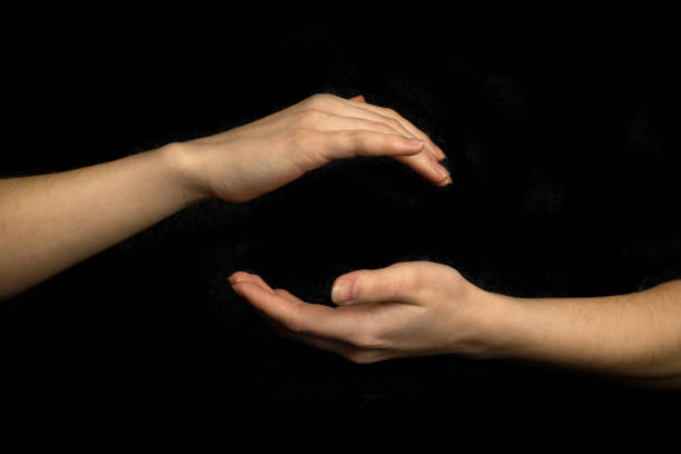istock Hand sphere or circle gesture isolated on a black background 1355627249
