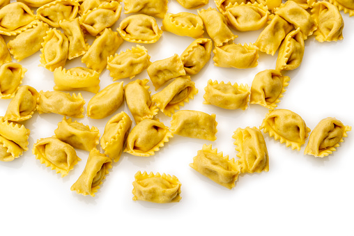 Ravioli del plin, typical pasta from Langhe, Piedmont, Italy - agnolotti isolated on white in top view