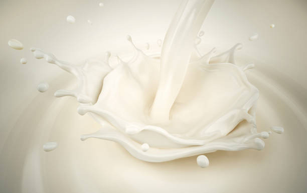 istock Milk pouring with crown splash. 1355629107