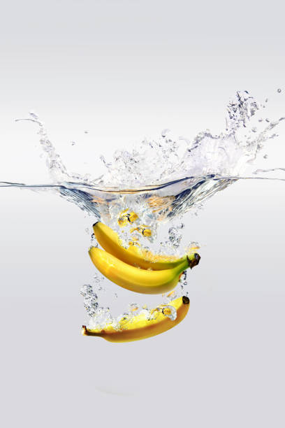 istock 3 bananas being washed with water 1355630179