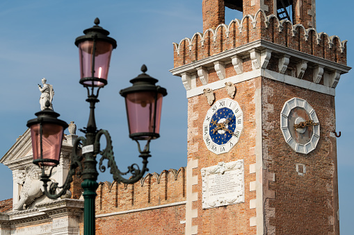 The entrance to the Arsenale in Venice (Italy) on a sunny day in autumn, lamp post