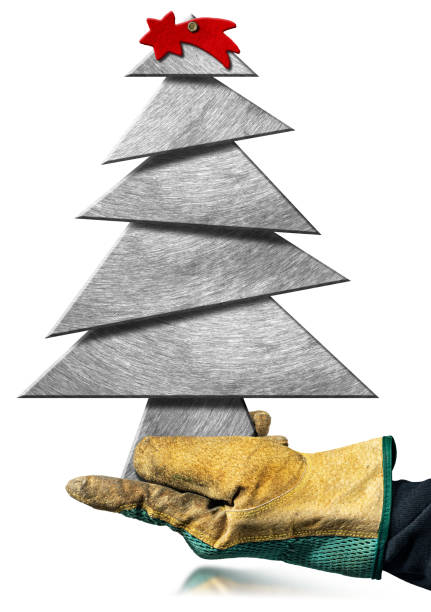 istock Gloved Hand Holding a Small Metallic Christmas Tree isolated on white