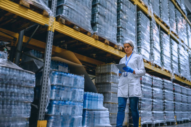 Woman working at a warehouse making an inventory