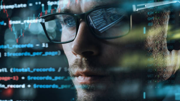 istock Close-up Portrait of Software Engineer Working on Computer, Line of Code Run Aroung Him. Developer Working on Innovative e-Commerce Application using Big Data Concept 1355632684