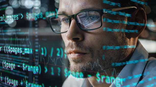 istock Close-up Portrait of Software Engineer Working on Computer, Line of Code Run Aroung Him. Developer Working on Innovative e-Commerce Application using Big Data Concept 1355632686