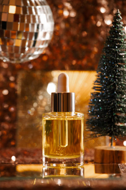 istock face oil on sequin background with disco ball and tree 1355634226