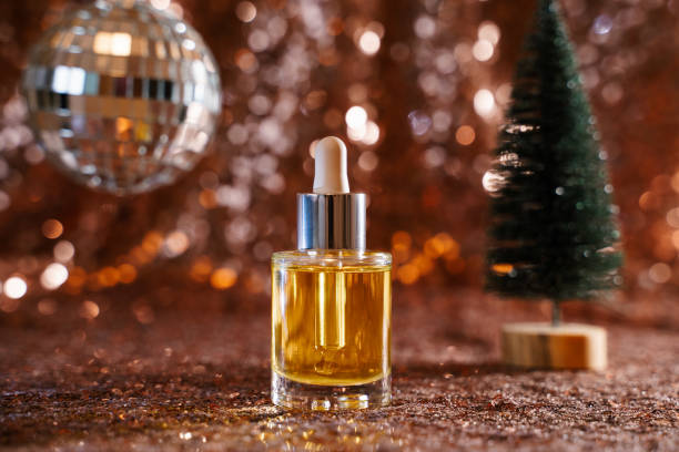 istock face oil on sequin background with disco ball and tree 1355634238