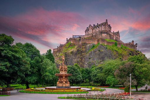 view on Edinburgh Castle from Princes Street Gardens with the Ross Fountain in the foreground, Edinburgh, Scotland, United Kingdom